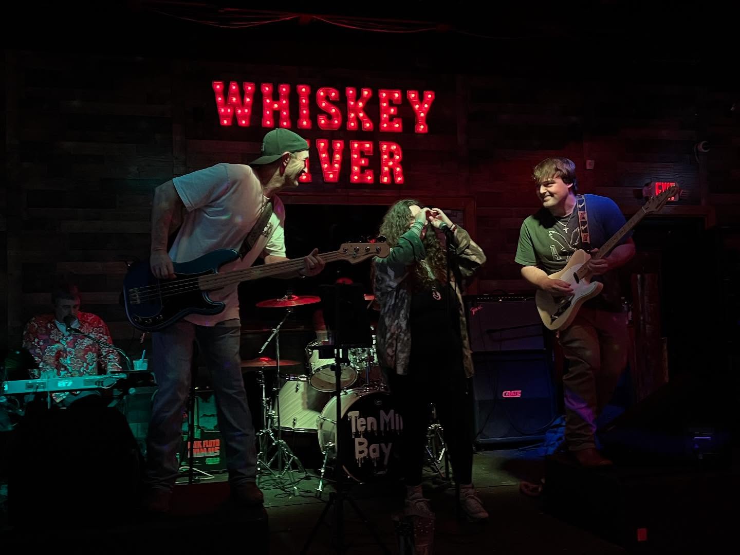 Ten Mile Bay jamming together on stage at Whiskey River