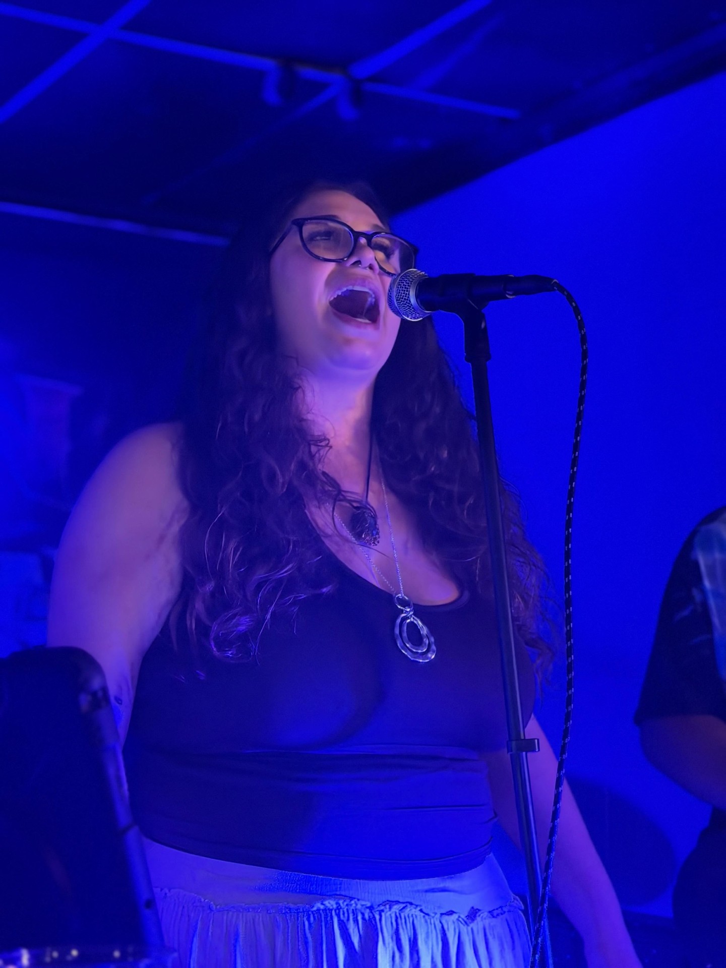 Ten Mile Bay vocalist belting it out under blue lights