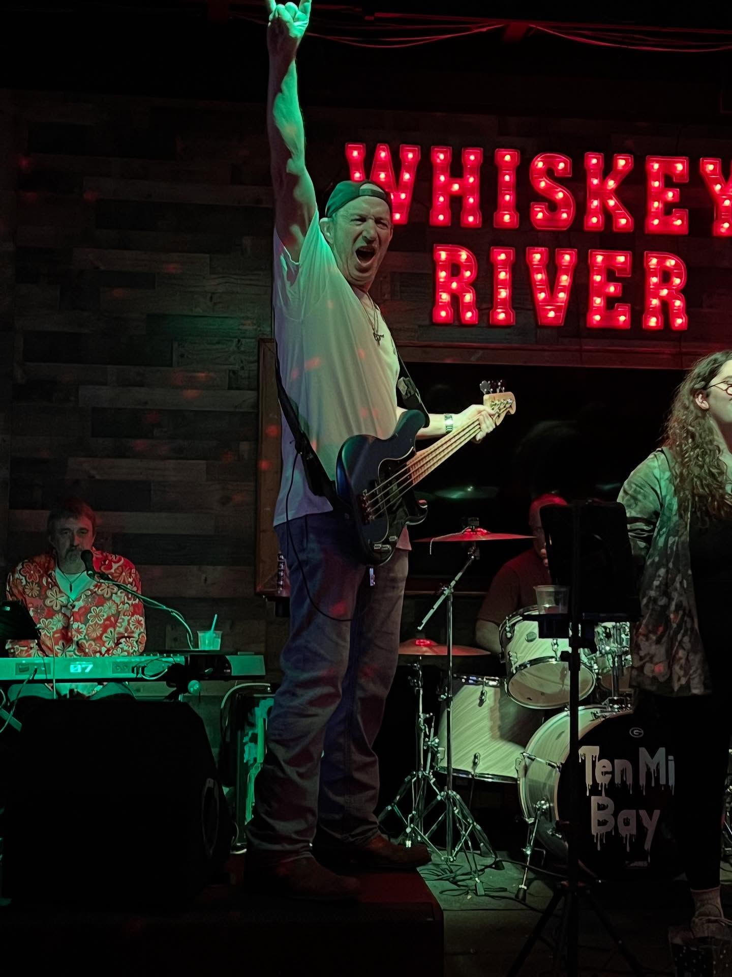 Mike Davidson throwing rock horns at Whiskey River